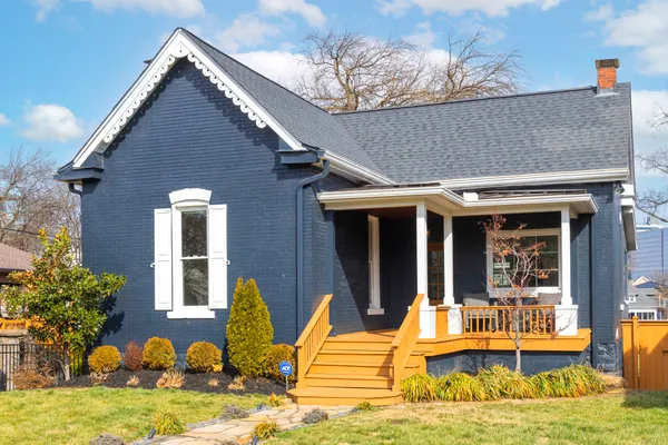 a view of house with outdoor seating