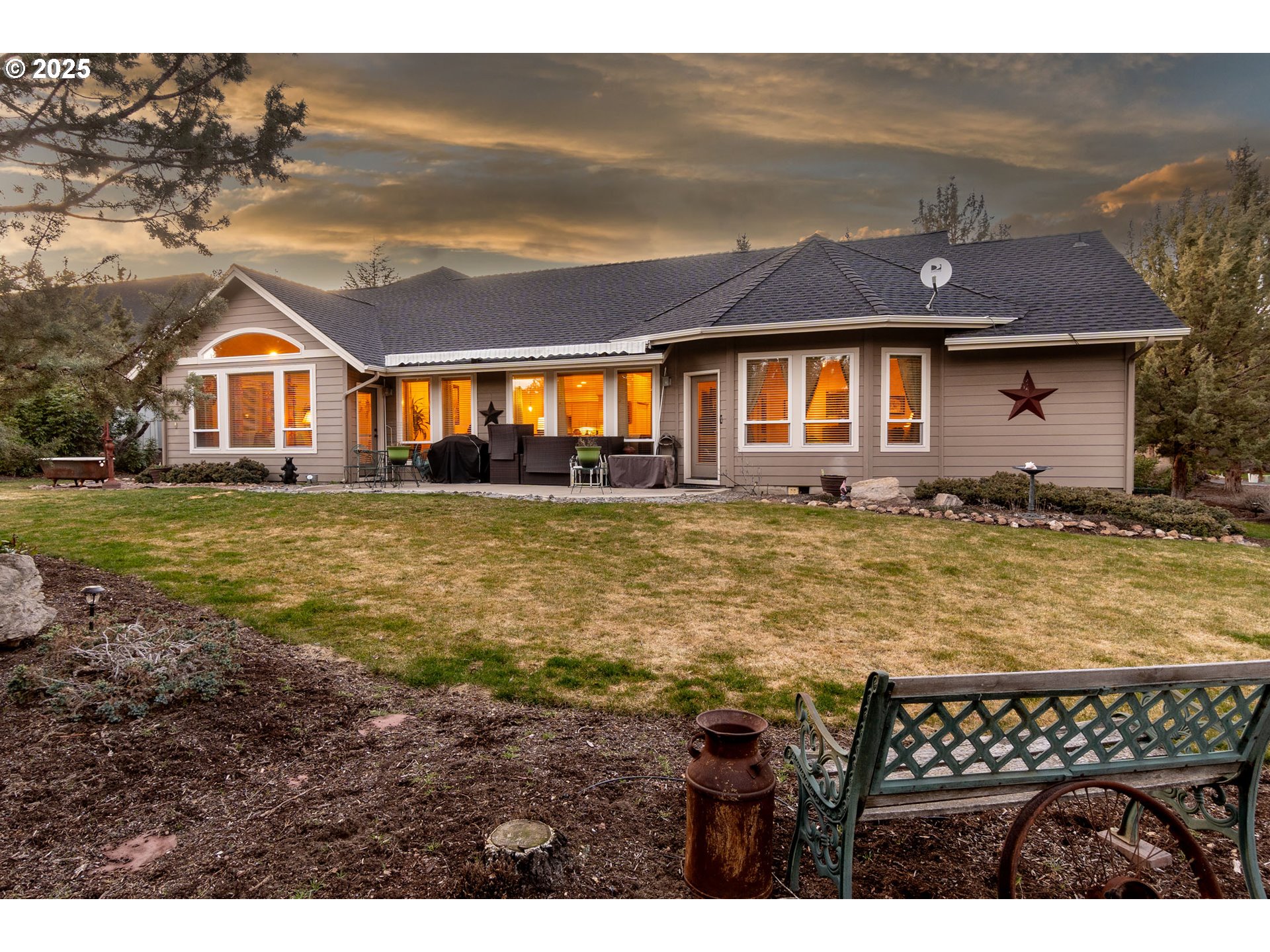 8830 Merlin Drive Redmond, OR 97756 - Photo 1 of 32 a front view of a house with a yard