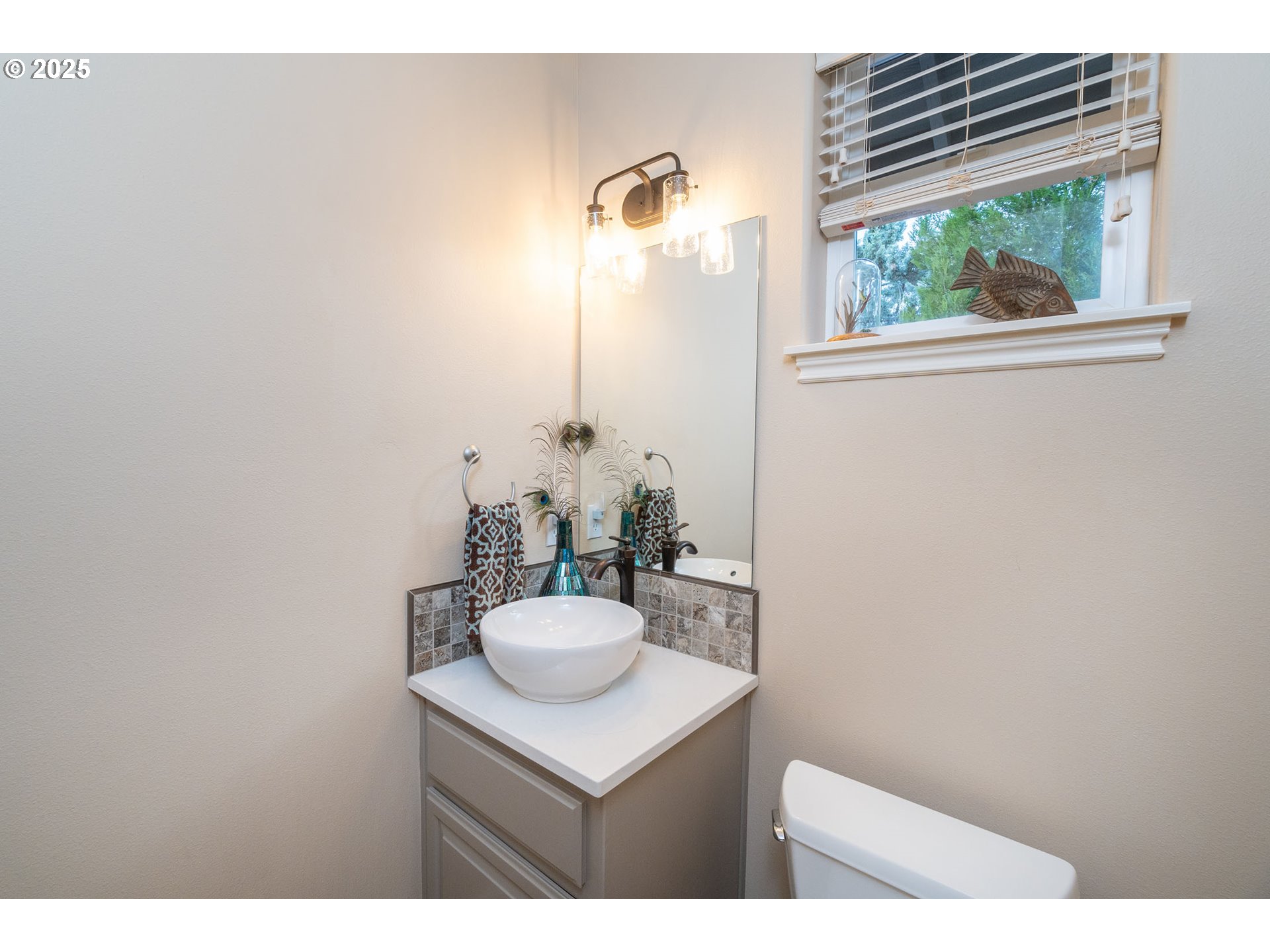 8830 Merlin Drive Redmond, OR 97756 - Photo 14 of 32 a bathroom with a sink and a mirror