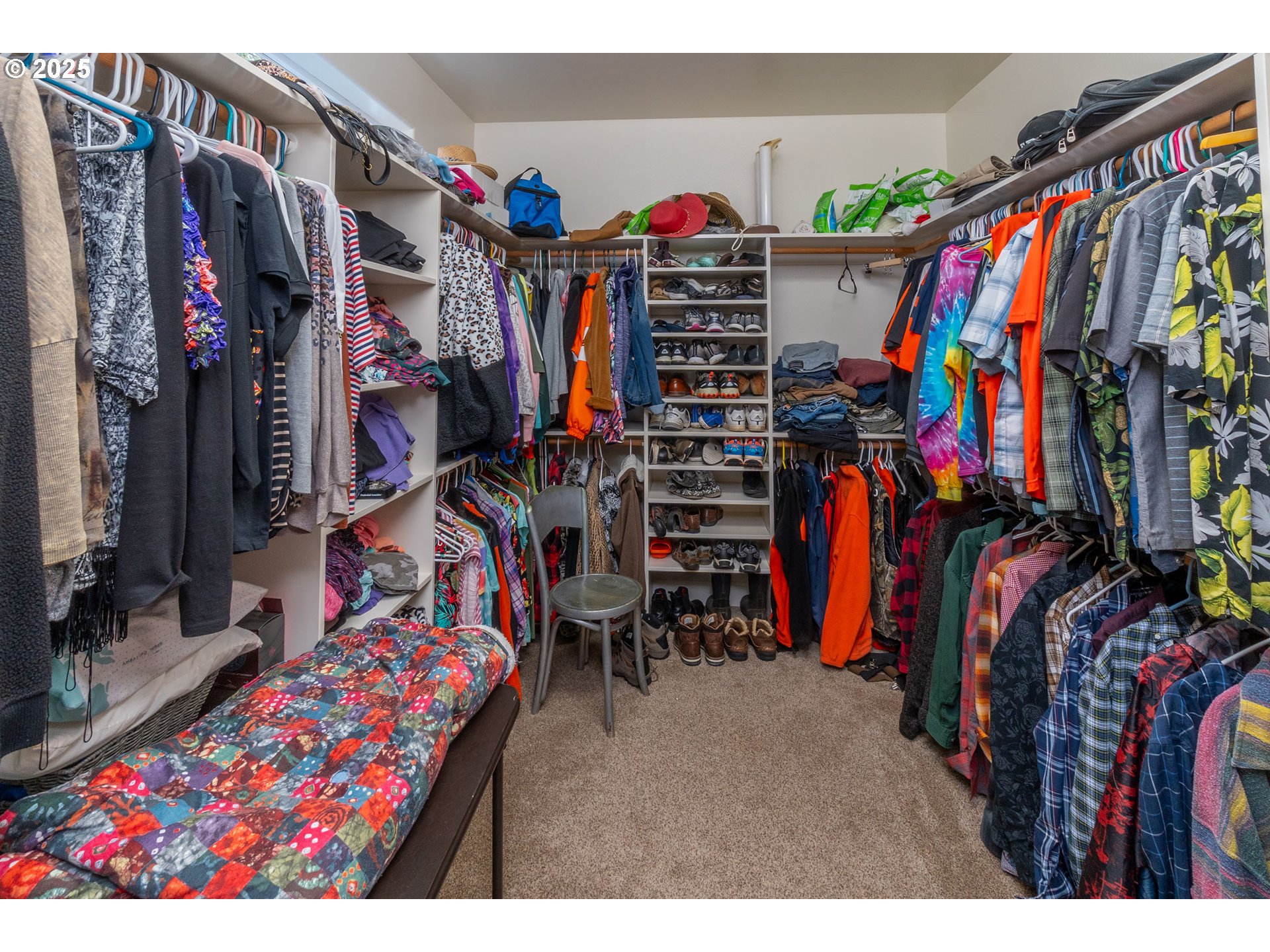 8830 Merlin Drive Redmond, OR 97756 - Photo 18 of 32 a view of walk in closet with clothes
