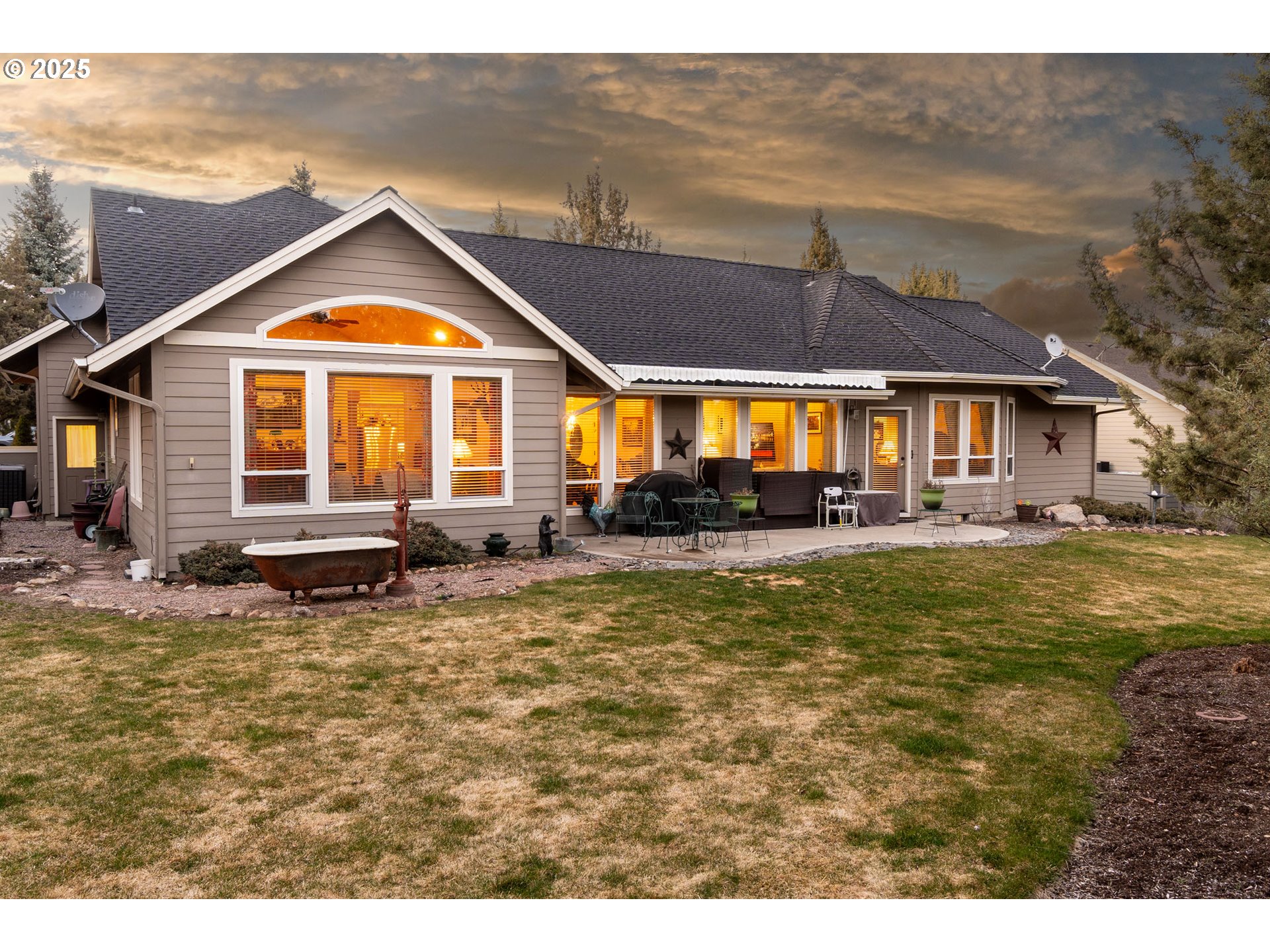 8830 Merlin Drive Redmond, OR 97756 - Photo 2 of 32 a front view of a house with a yard