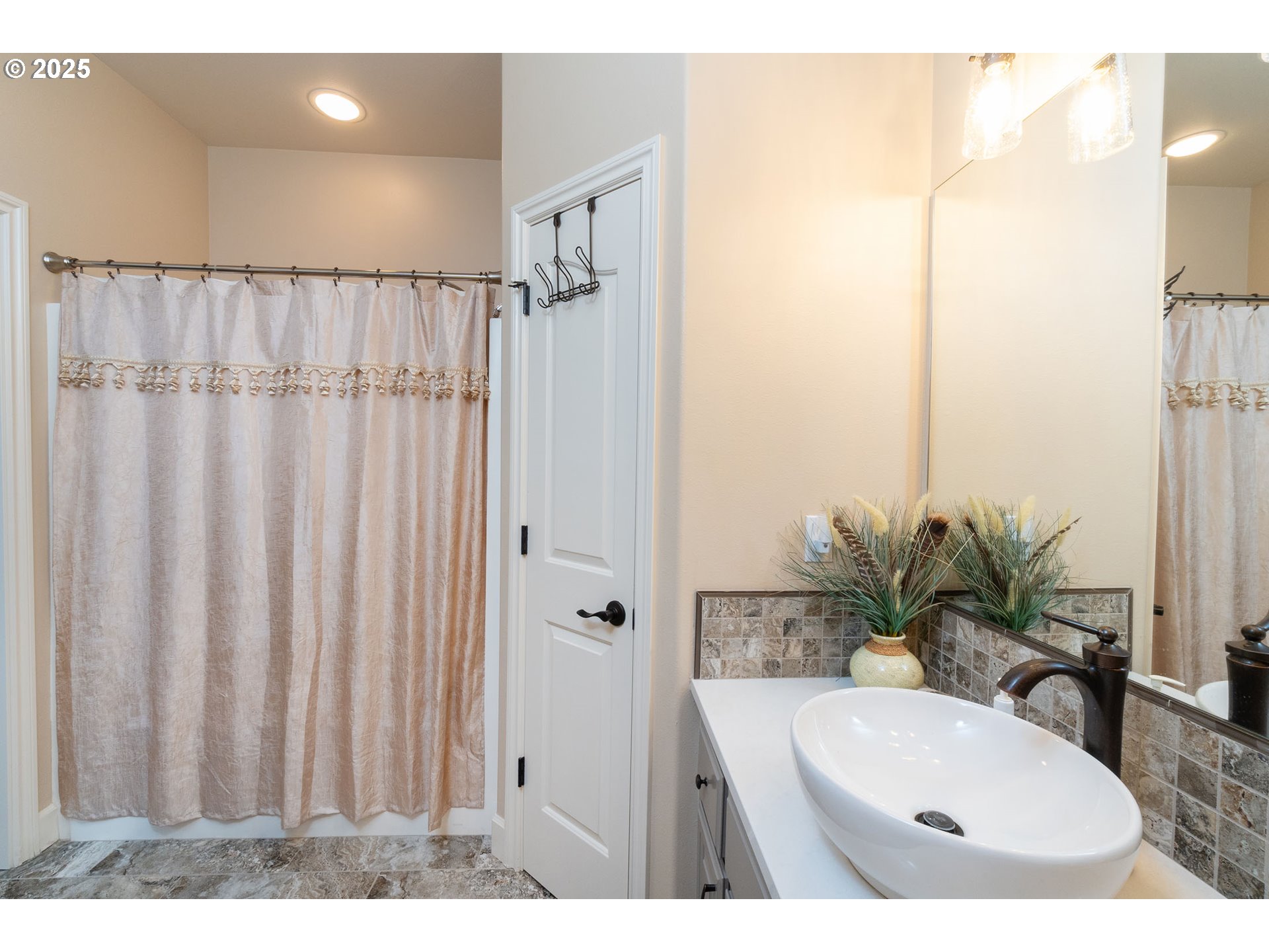 8830 Merlin Drive Redmond, OR 97756 - Photo 21 of 32 a bathroom with a sink and a mirror