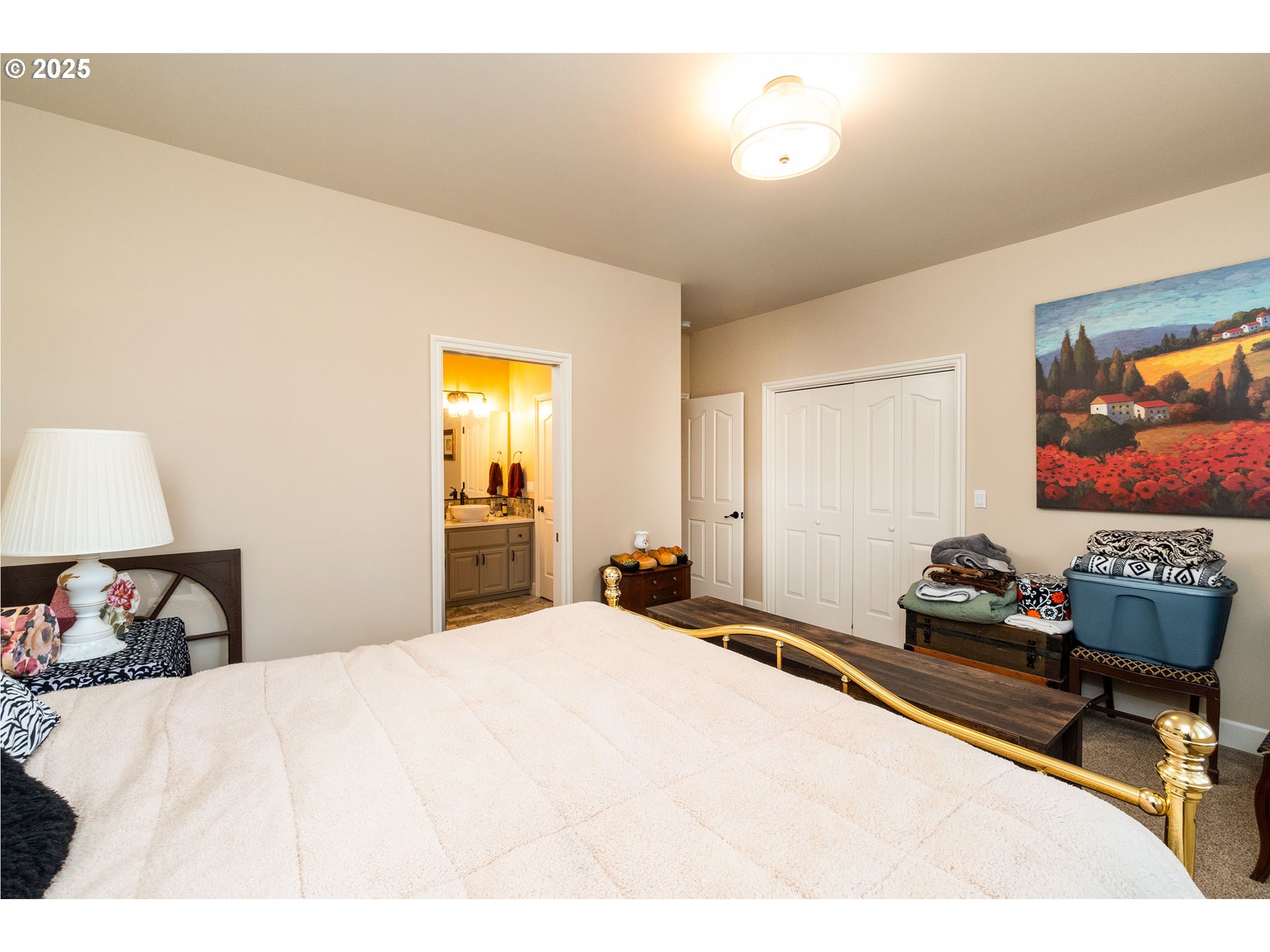 8830 Merlin Drive Redmond, OR 97756 - Photo 23 of 32 a bedroom with a bed and a flat screen tv