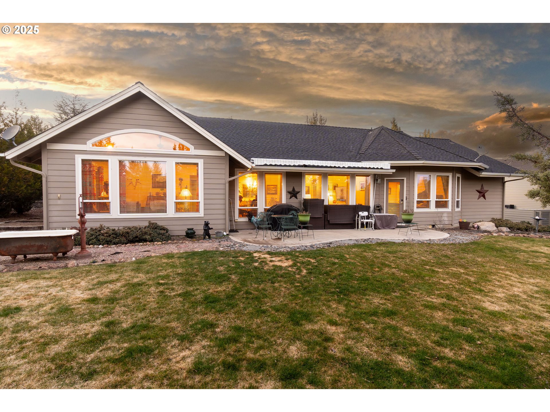 8830 Merlin Drive Redmond, OR 97756 - Photo 3 of 32 a front view of house with yard and outdoor seating