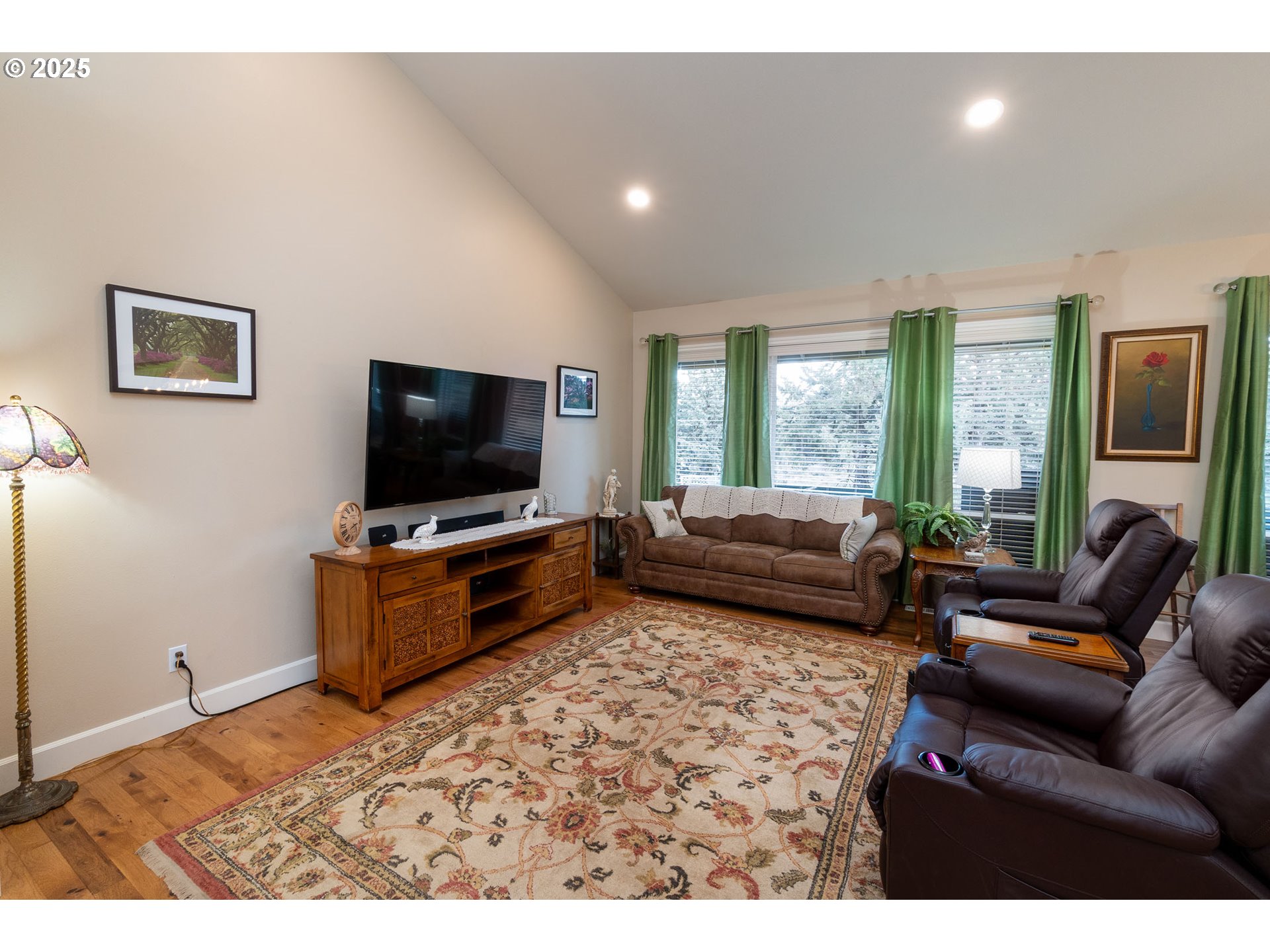 8830 Merlin Drive Redmond, OR 97756 - Photo 6 of 32 a living room with furniture and a flat screen tv