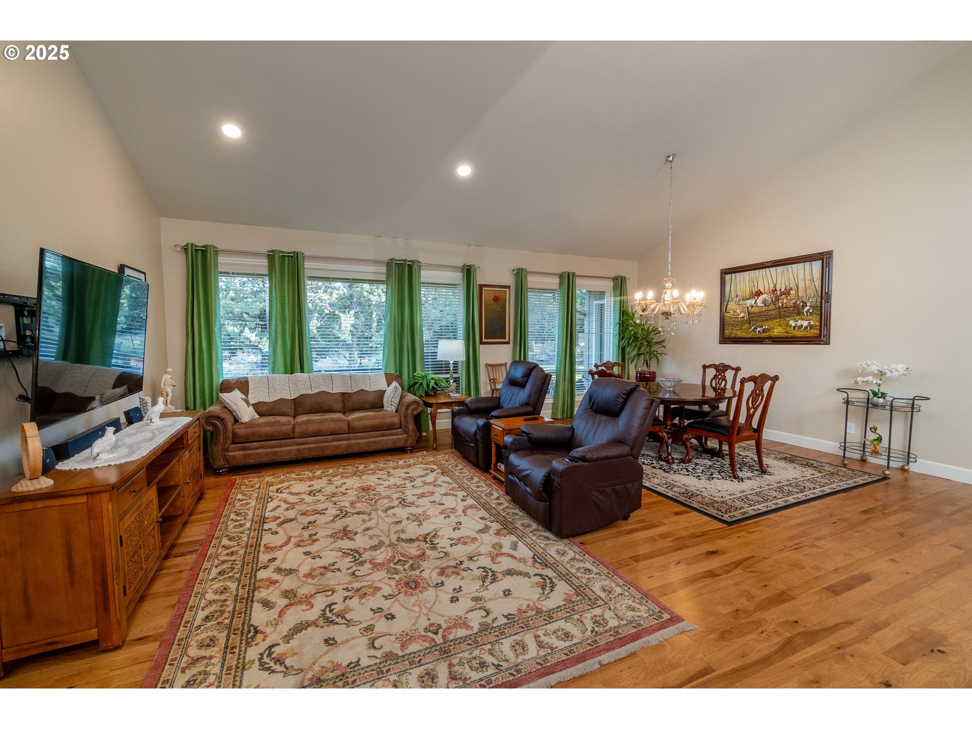 8830 Merlin Drive Redmond, OR 97756 - Photo 8 of 32 a living room with furniture large window and a flat screen tv
