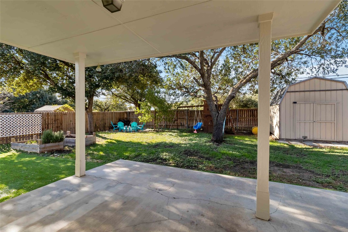 1320 Lochaline Loop Pflugerville, TX 78660 - Photo 28 of 35 Fenced backyard featuring a storage shed and a patio area