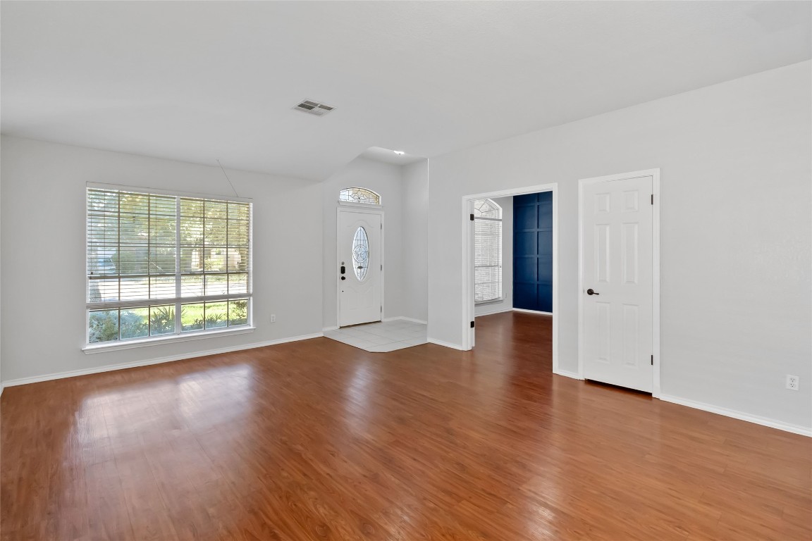 1320 Lochaline Loop Pflugerville, TX 78660 - Photo 8 of 35 Foyer featuring light wood-style floors and baseboards