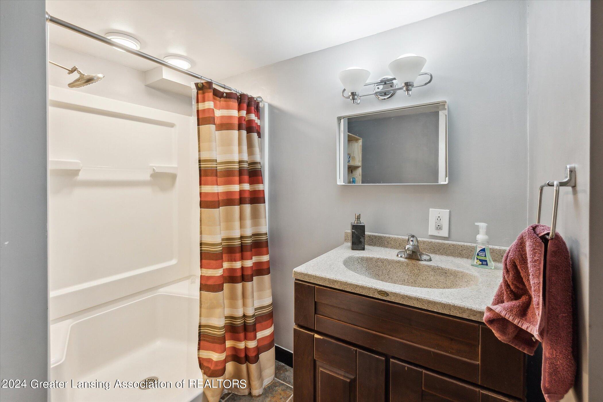 412 Strathmore Road Lansing, MI 48910 - Photo 28 of 31 Lower Level Full Bath