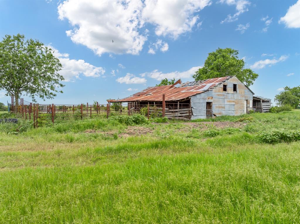 12069 Fm-1602 Hamilton, TX 76531 - Photo 7 of 32 View of yard with an outbuilding, a barn, and fence