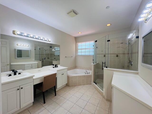 30 Beechdale Lane Boynton Beach, FL 33426 - Photo 13 of 25 a large bathroom with a double vanity sink a large mirror and a bathtub
