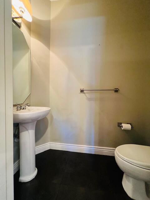 30 Beechdale Lane Boynton Beach, FL 33426 - Photo 10 of 25 a bathroom with a sink and a toilet