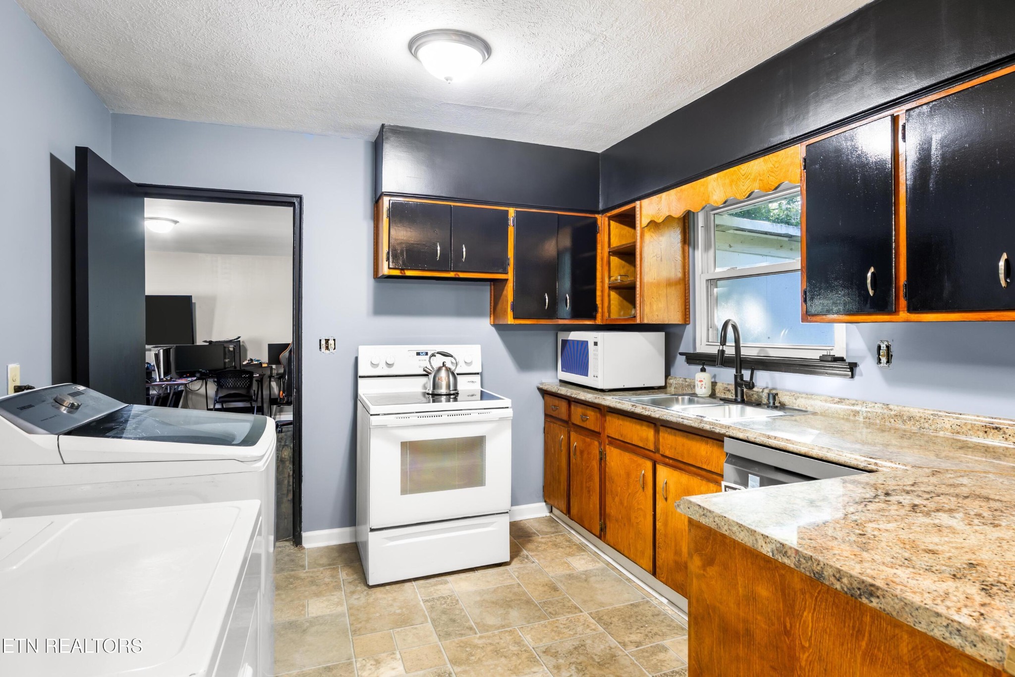 657 Robertsville Road Oak Ridge, TN 37830 - Photo 11 of 28 a kitchen with a sink stove and refrigerator