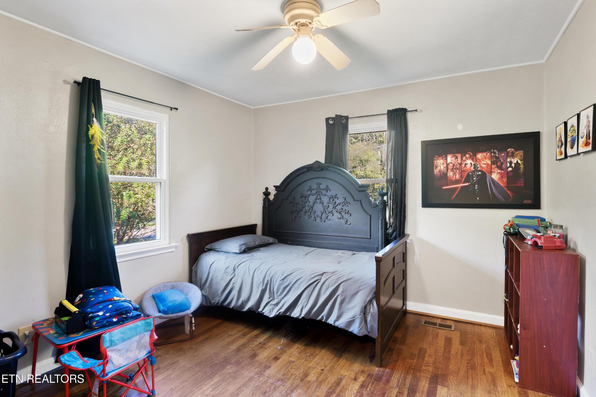 657 Robertsville Road Oak Ridge, TN 37830 - Photo 18 of 28 a bedroom with a bed and wooden floor