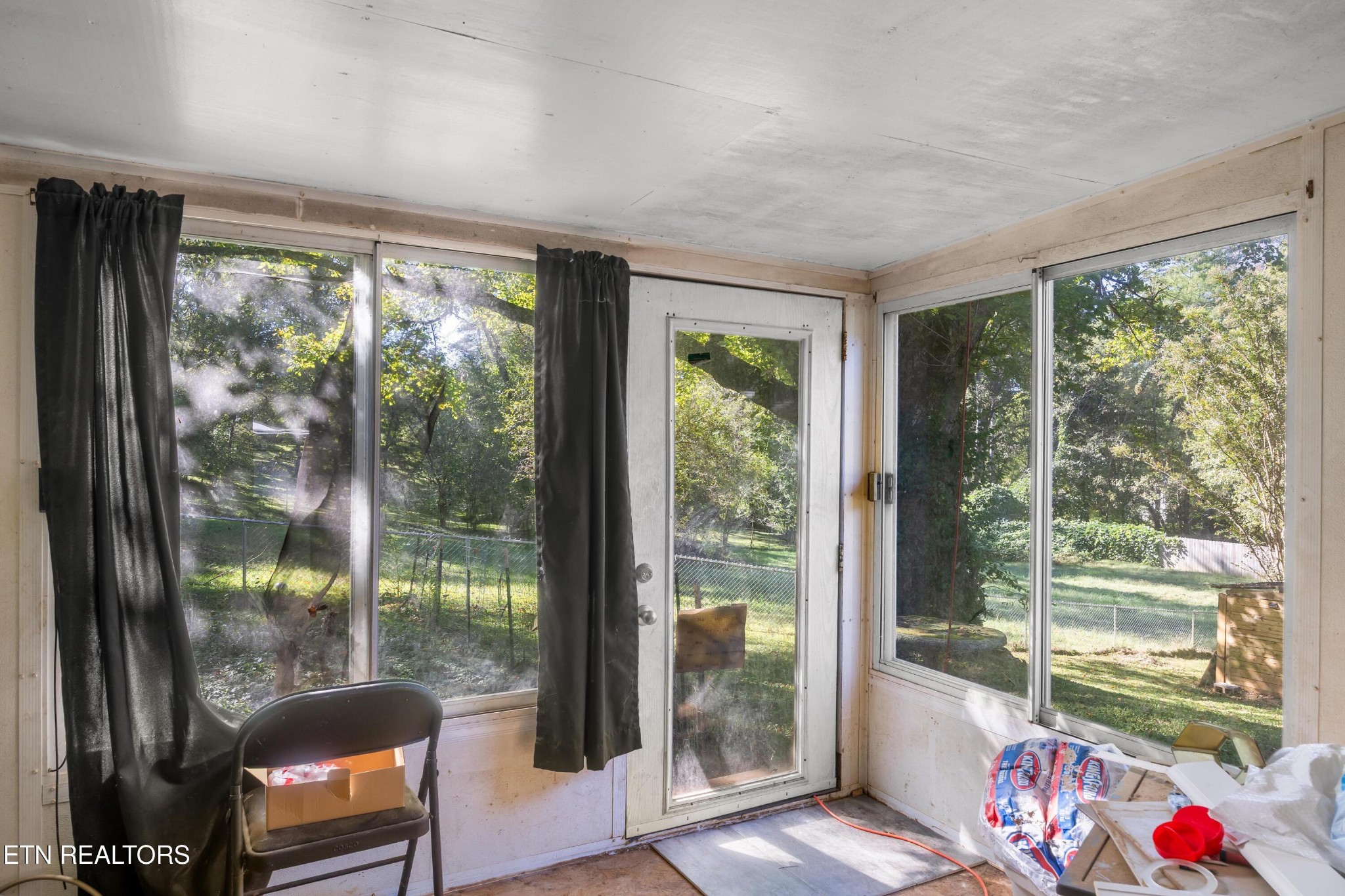657 Robertsville Road Oak Ridge, TN 37830 - Photo 23 of 28 a room with toys and floor to ceiling windows