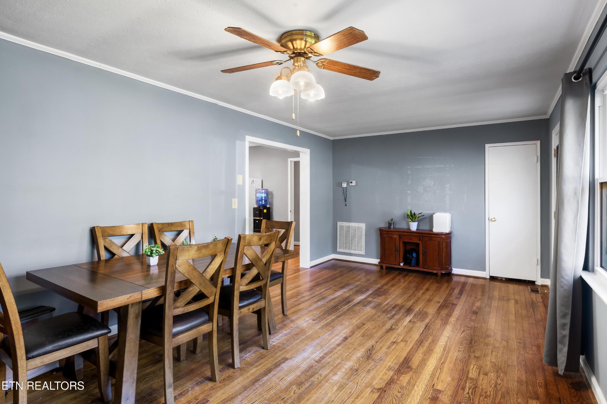 657 Robertsville Road Oak Ridge, TN 37830 - Photo 3 of 28 a view of a dining room with furniture and wooden floor
