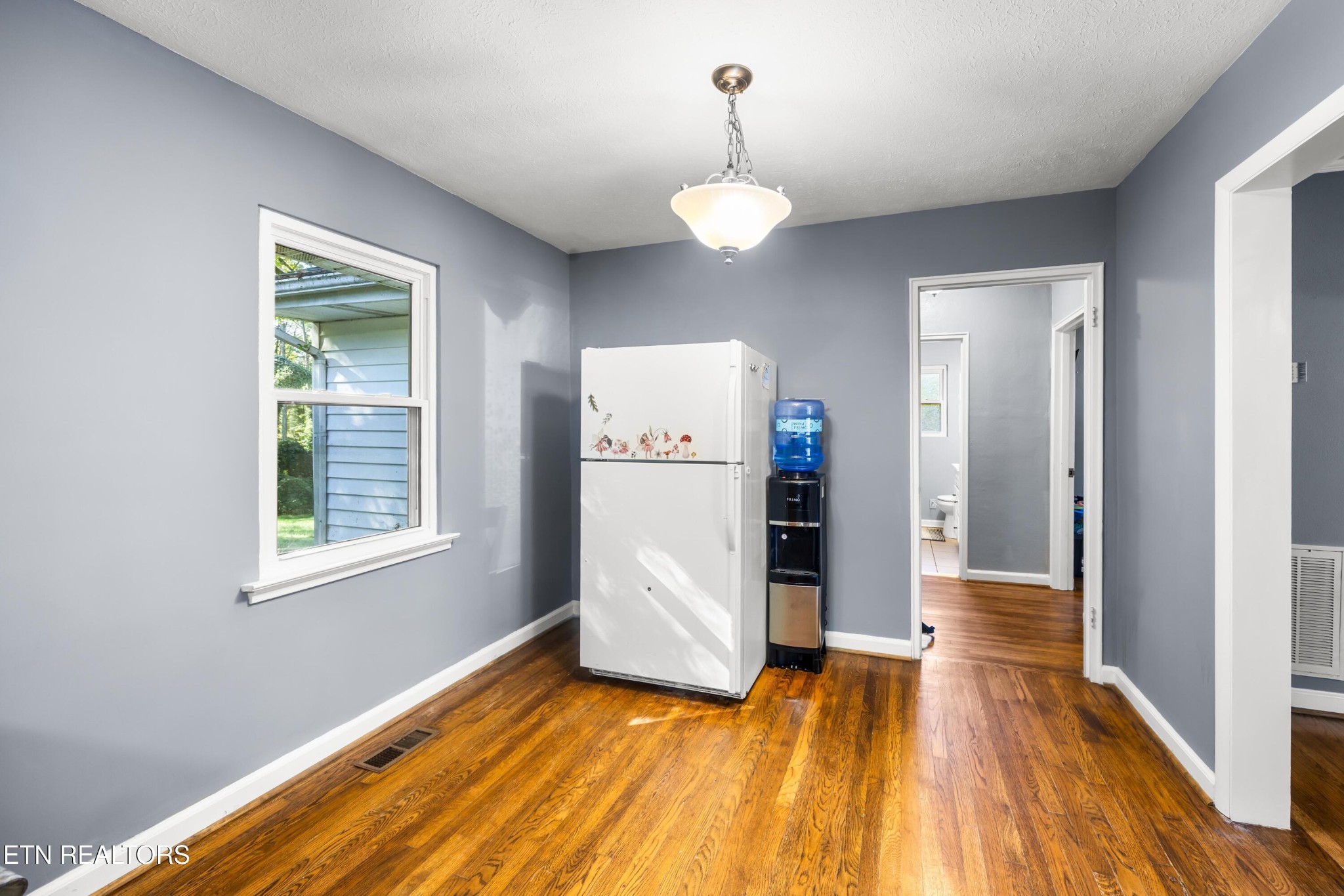 657 Robertsville Road Oak Ridge, TN 37830 - Photo 10 of 28 a view of a room with wooden floor and window