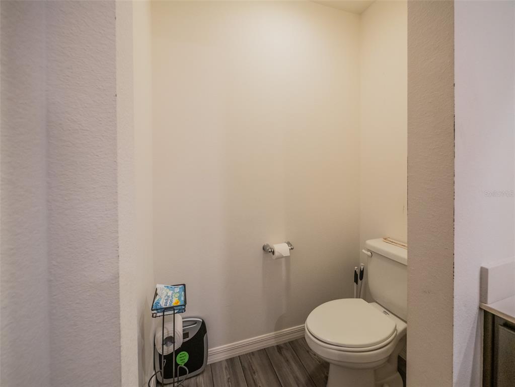 938 Mansfield Road Tavares, FL 32778 - Photo 18 of 25 a white toilet sitting next to a sink