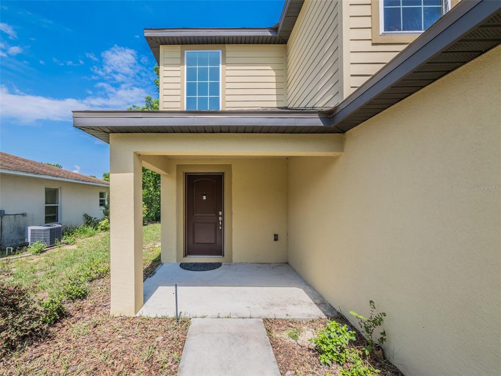 938 Mansfield Road Tavares, FL 32778 - Photo 2 of 25 a view of a house with a wooden fence