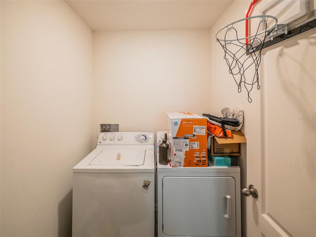 938 Mansfield Road Tavares, FL 32778 - Photo 23 of 25 a utility room with dryer and washer