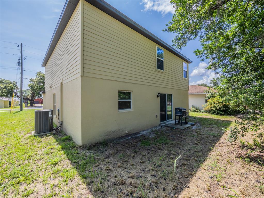938 Mansfield Road Tavares, FL 32778 - Photo 25 of 25 a view of a house with a backyard