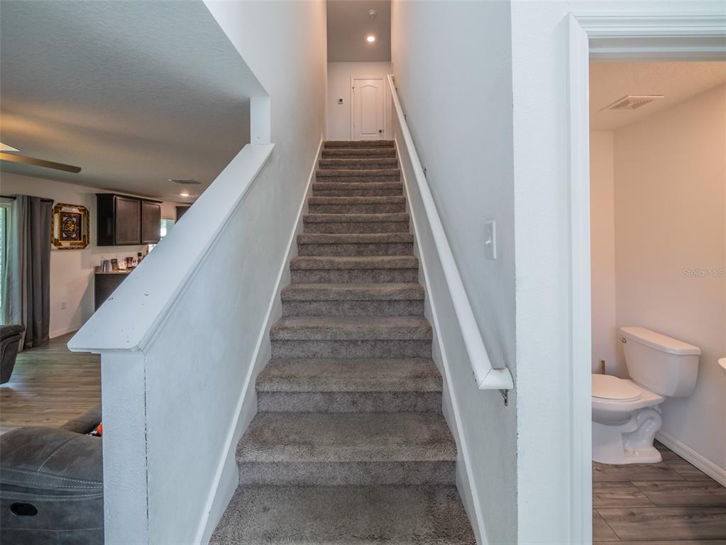 938 Mansfield Road Tavares, FL 32778 - Photo 4 of 25 a view of entryway and hall with wooden floor