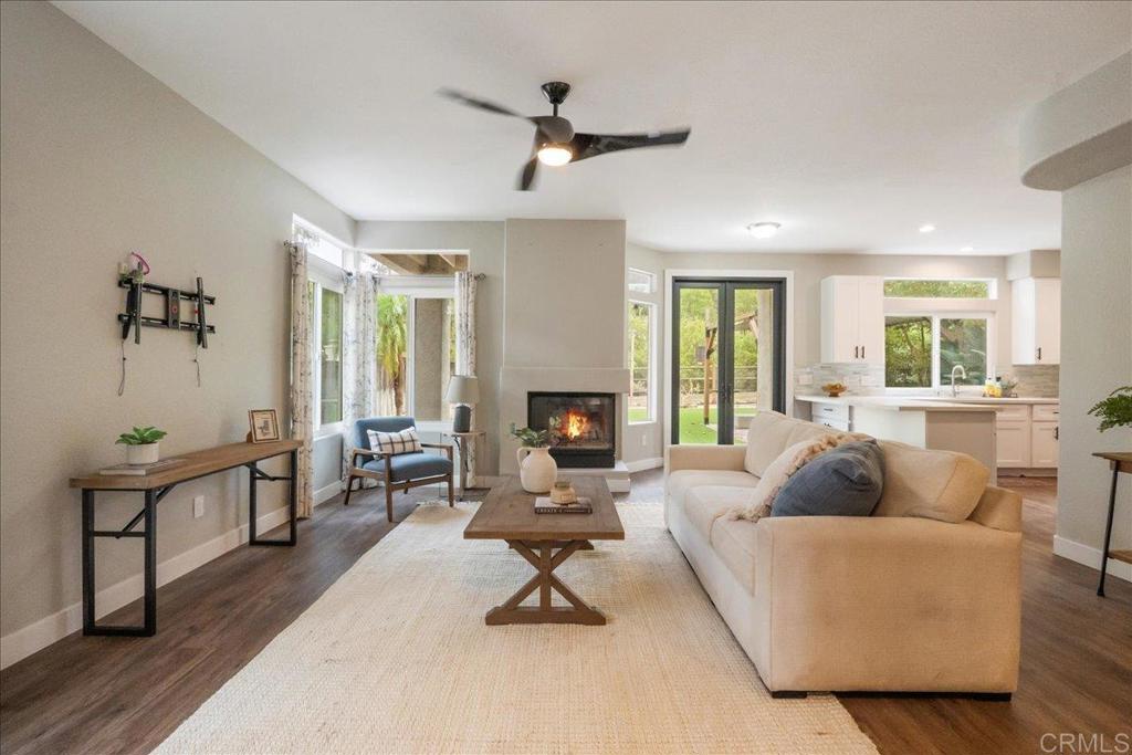 3631 Via Bernardo Oceanside, CA 92056 - Photo 13 of 38 a living room with furniture and a fireplace
