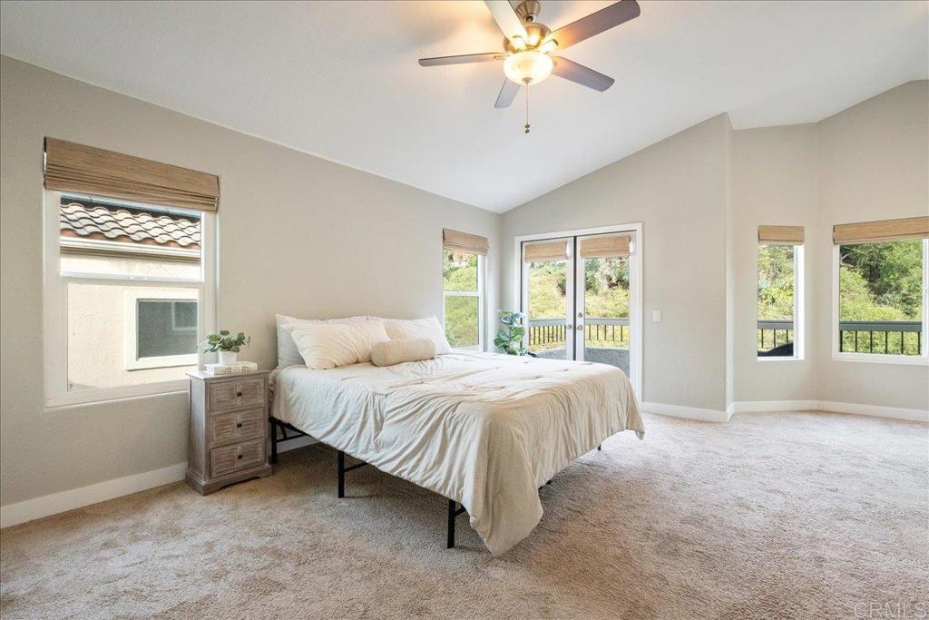 3631 Via Bernardo Oceanside, CA 92056 - Photo 19 of 38 a spacious bedroom with a bed and a window