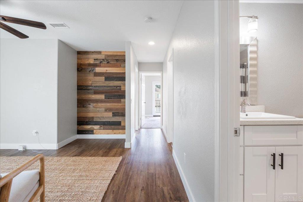3631 Via Bernardo Oceanside, CA 92056 - Photo 31 of 38 a view of a hallway with wooden floor and closet