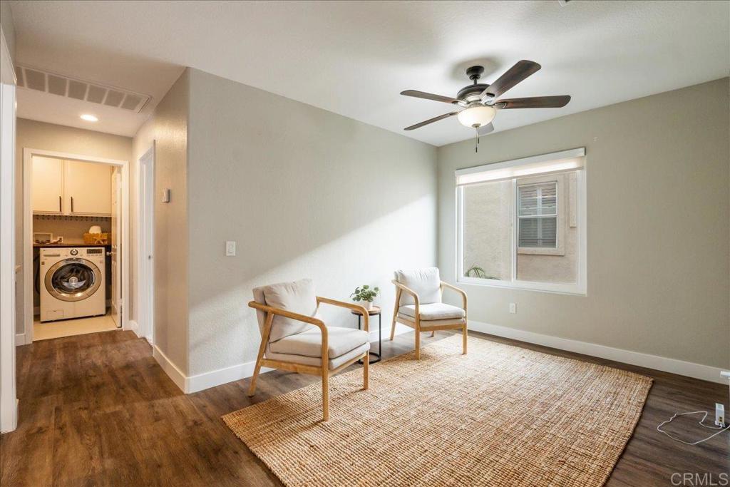 3631 Via Bernardo Oceanside, CA 92056 - Photo 32 of 38 a living room with a bed furniture and a window