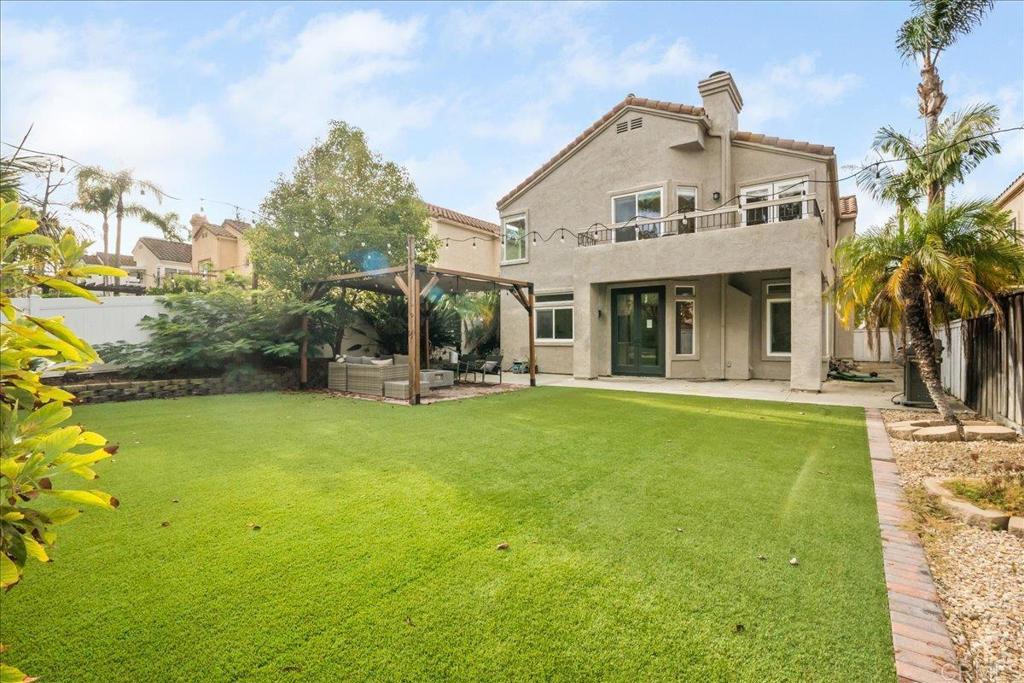 3631 Via Bernardo Oceanside, CA 92056 - Photo 34 of 38 a front view of a house with a garden