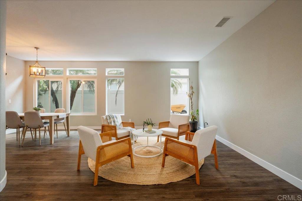 3631 Via Bernardo Oceanside, CA 92056 - Photo 6 of 38 a living room with couches chairs and large window with wooden floor