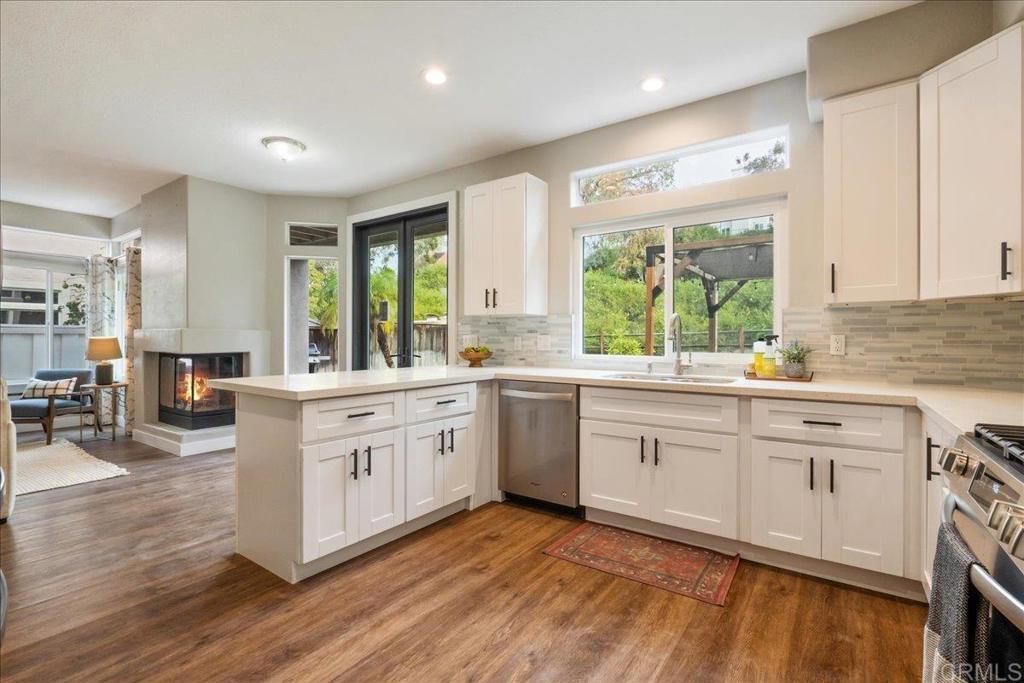 3631 Via Bernardo Oceanside, CA 92056 - Photo 8 of 38 a large white kitchen with a large window