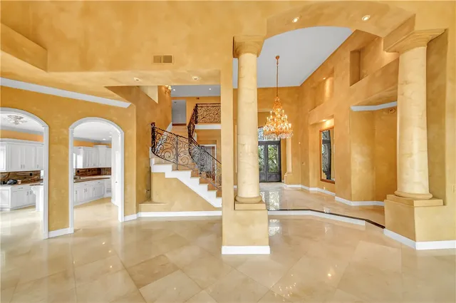 a view of a living room with a large tree