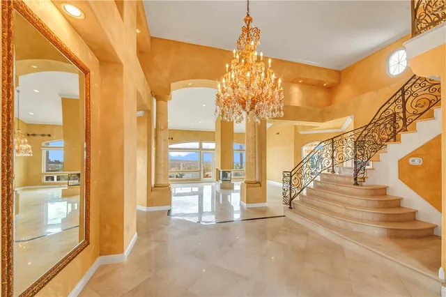 a view of an entryway with a floor to ceiling window and couch