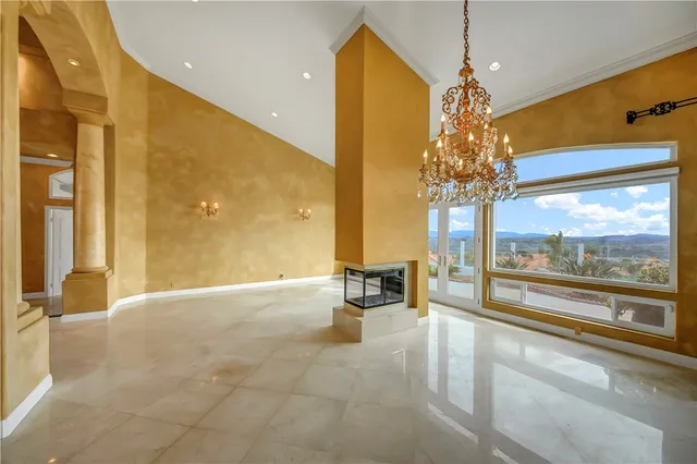 a large kitchen with stainless steel appliances granite countertop a lot of counter space and wooden floor