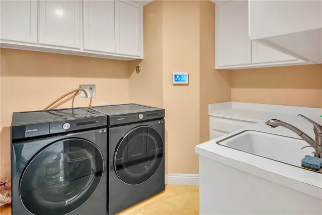 a large spacious bathroom with a large tub and shower