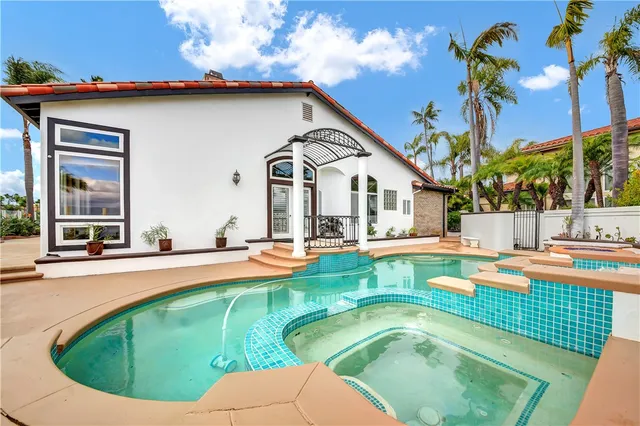 a view of a house with swimming pool