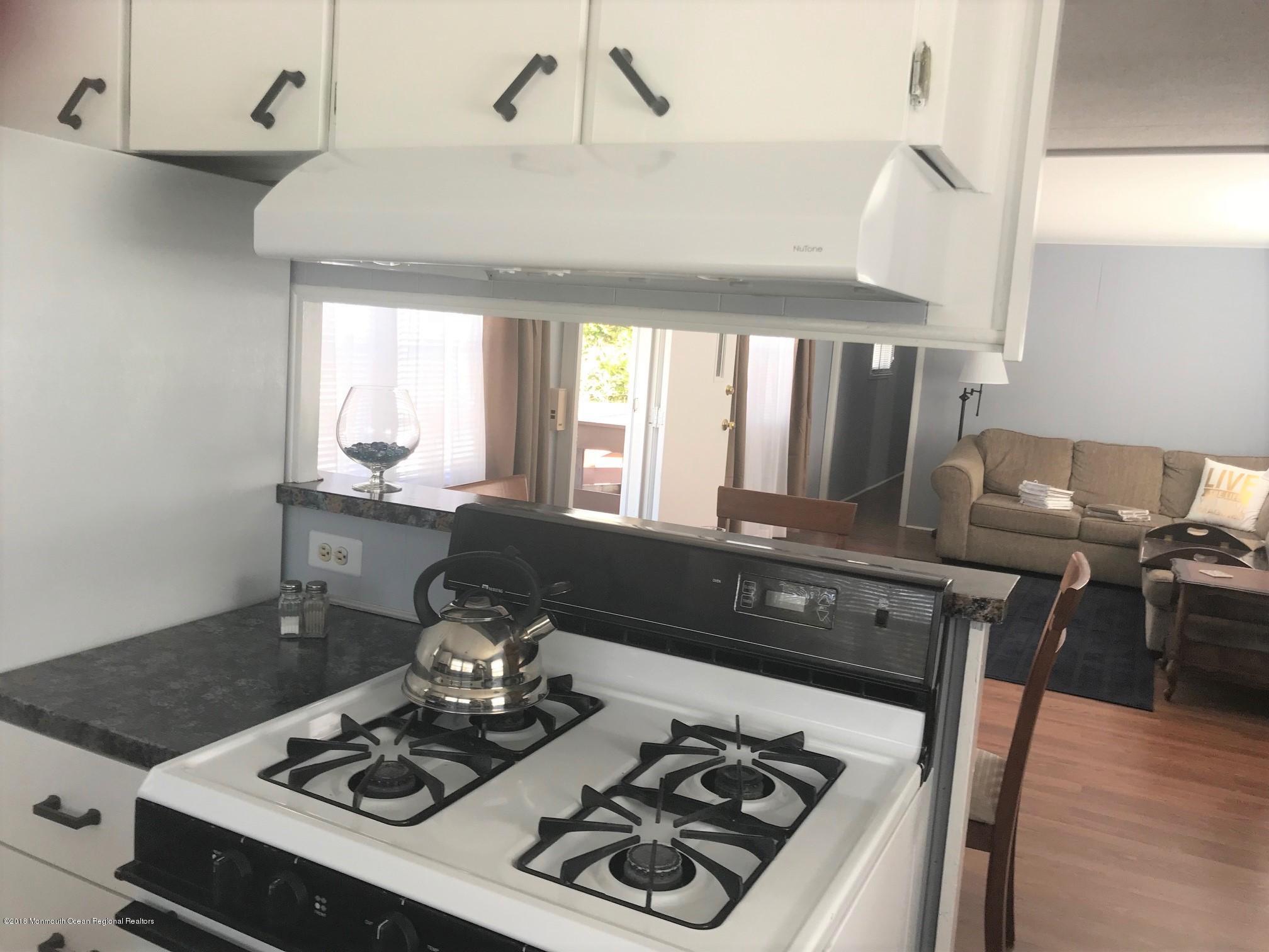 65 Roberts Road Toms River, NJ 08755 - Photo 8 of 24 a kitchen with a stove and a sink