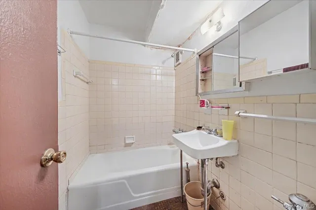 a bathroom with a sink and a bathtub