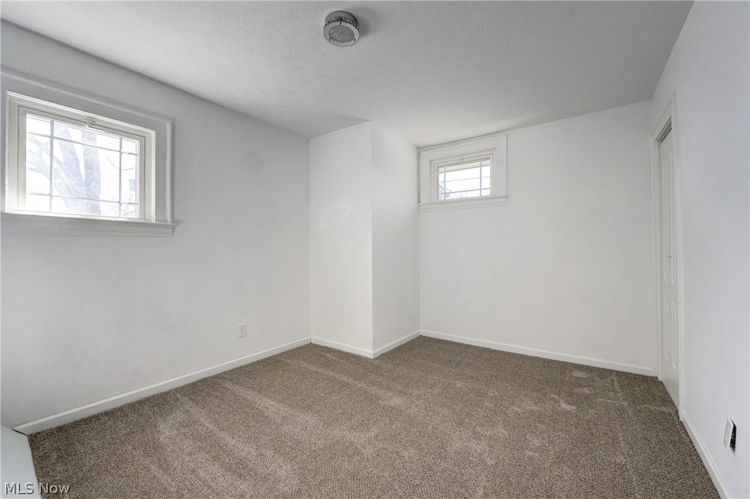 3164 Whitethorn Road Cleveland, OH 44118 - Photo 18 of 31 Carpeted empty room featuring plenty of natural light