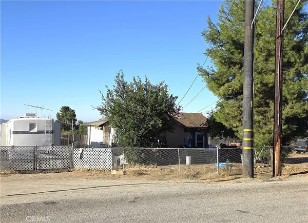 a view of a houses with a street