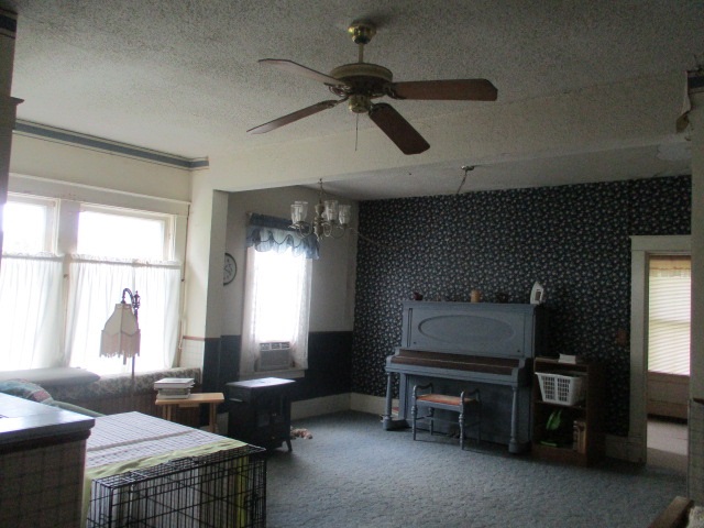 1234 South Lynnville Road Rochelle, IL 61068 - Photo 3 of 25 a living room with furniture a window and a table