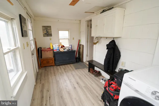 a view of a room with toys and wooden floor