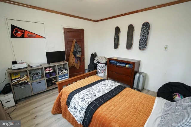 a bed sitting in a bedroom next to a window