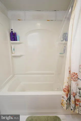 a kitchen with a refrigerator and a stove