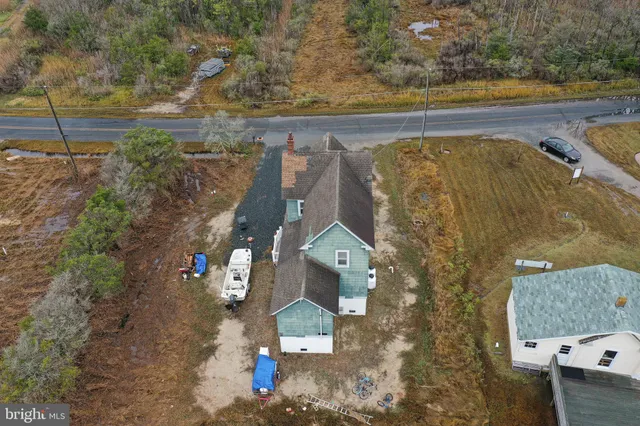 an aerial view of a house with a lake view