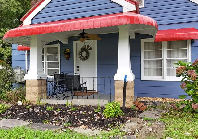 a view of a cafe with sitting area
