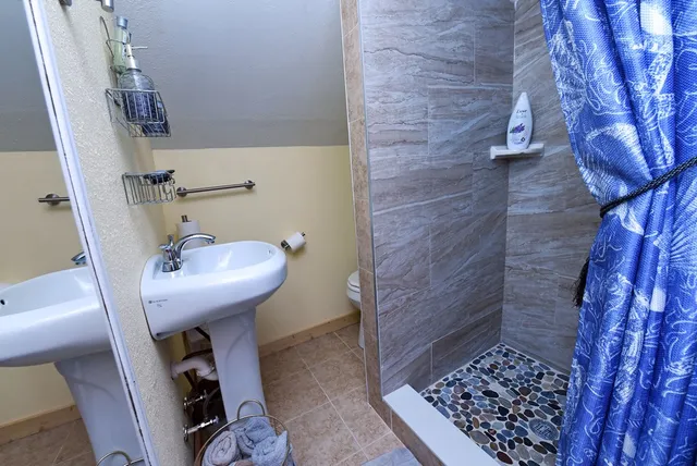 a bathroom with a sink and mirror