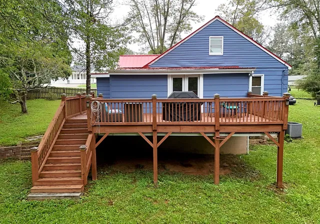 a view of a chairs and table on the deck